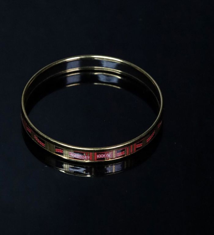 A Hermes Narrow enamel gold plated bangle