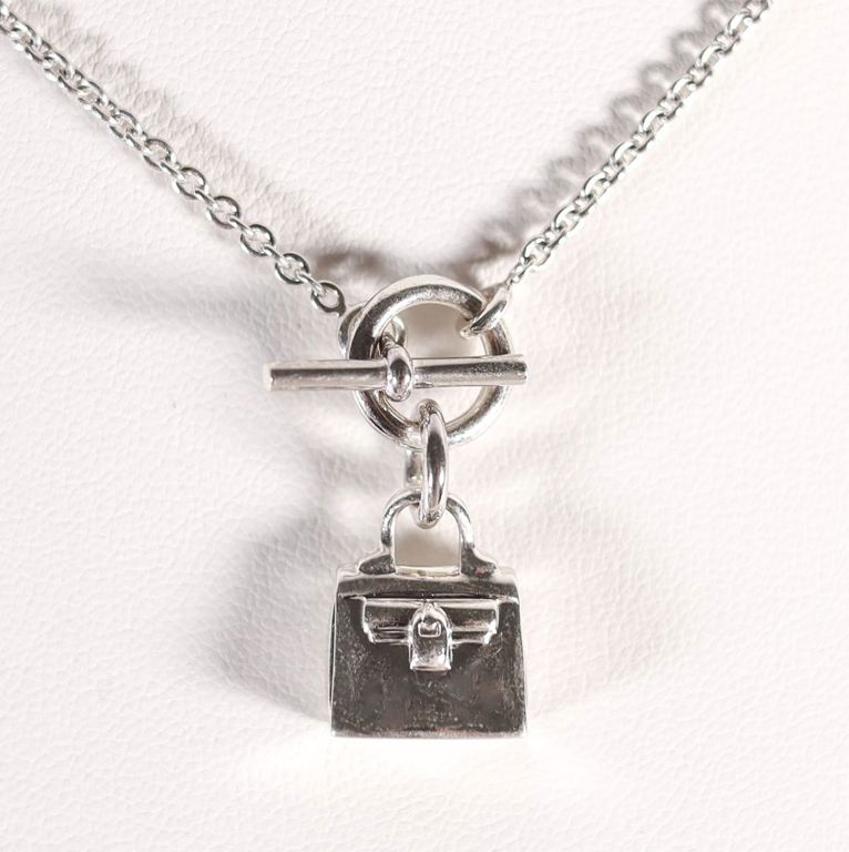 A Hermes Kelly sterling silver necklace with pendant