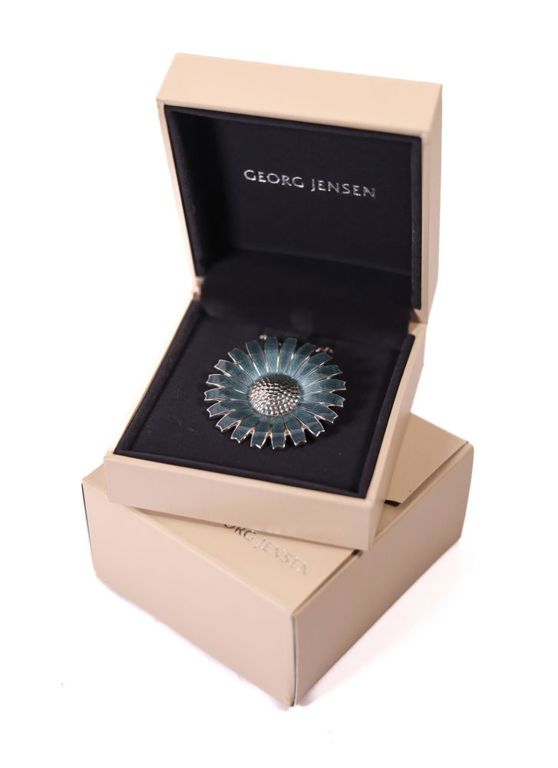A Georg Jensen sterling silver flower brooch on necklace