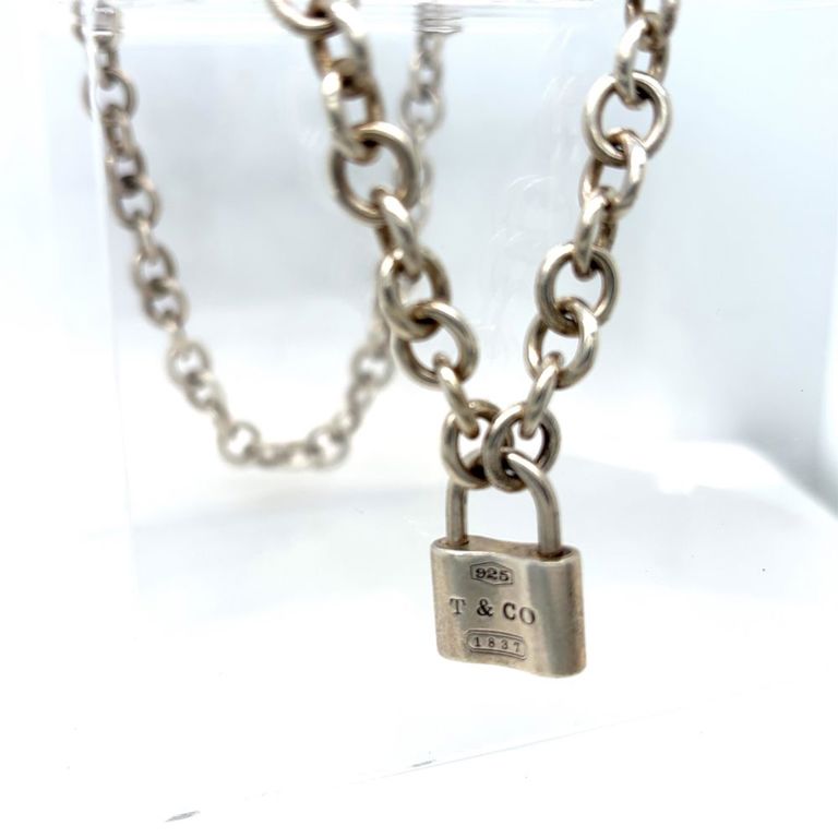 Sterling silver lock pendant on necklace