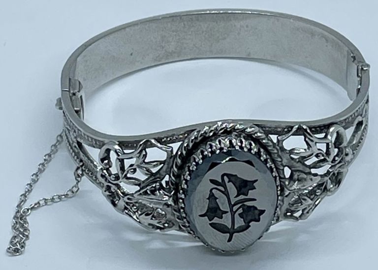 Silver tone metal Intaglio hinged bracelet