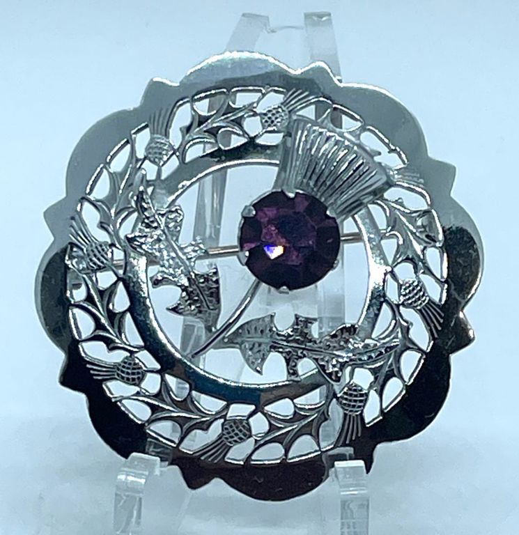 Silver tone metal purple stone brooch