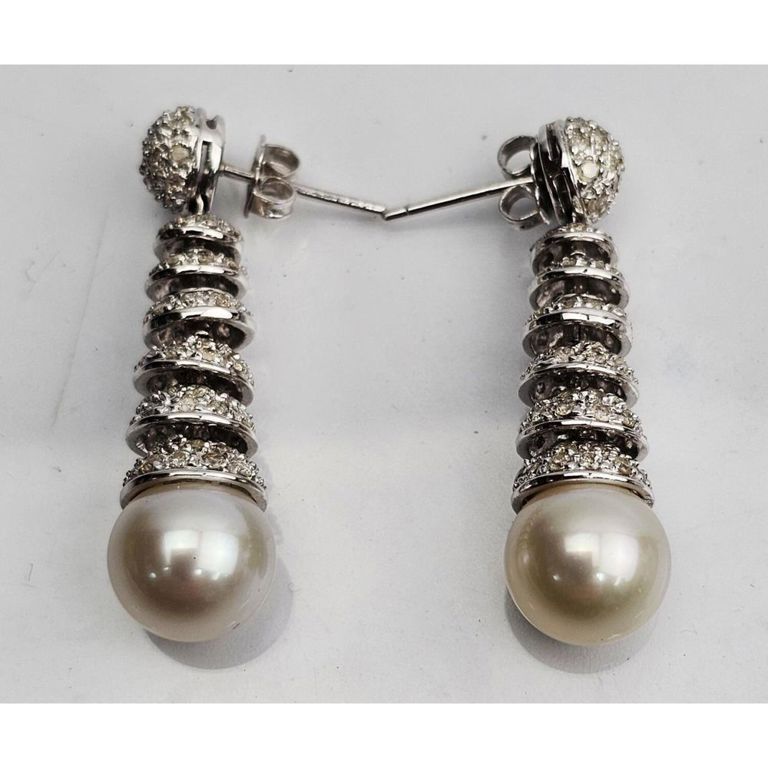 Fine pair of 18k white gold, pearl, and diamond hanging earrings