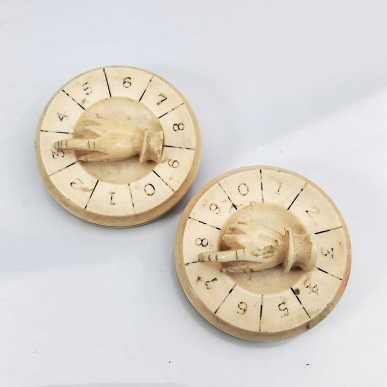Pair of antique whist game circular brooches
