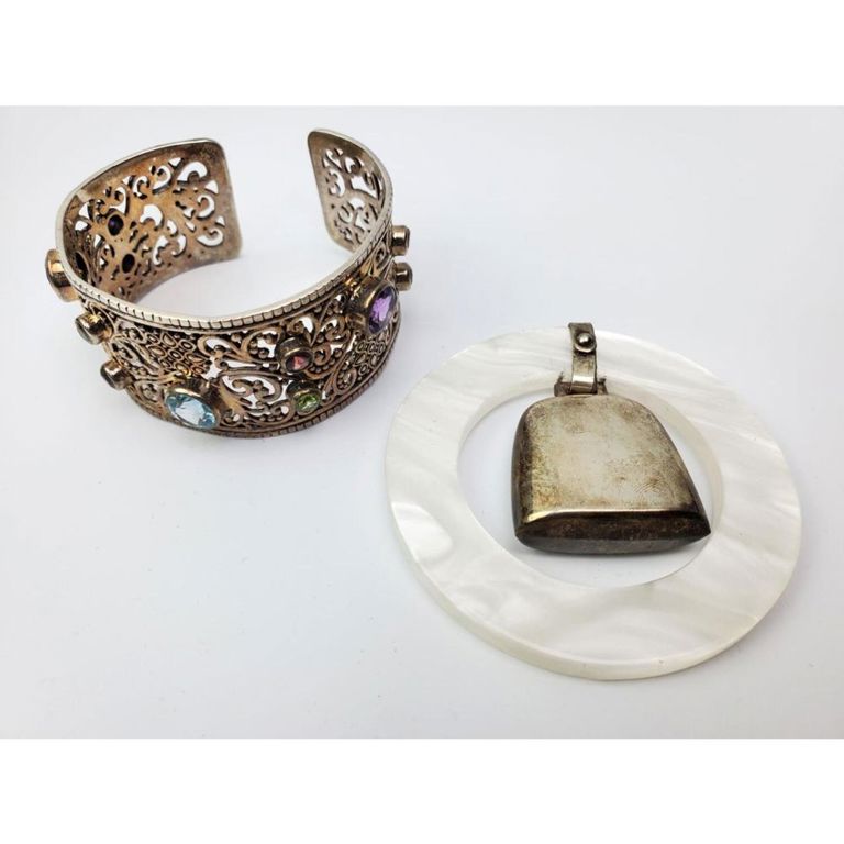 Sterling silver cuff bracelet by Samuel B. and baby rattle