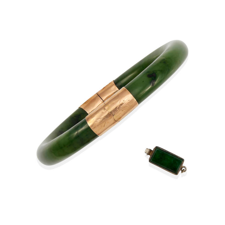A 14k white gold jade clasp and an 11k gold jade bangle bracelet