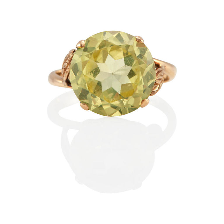 14k gold and greenish yellow synthetic sapphire solitaire ring
