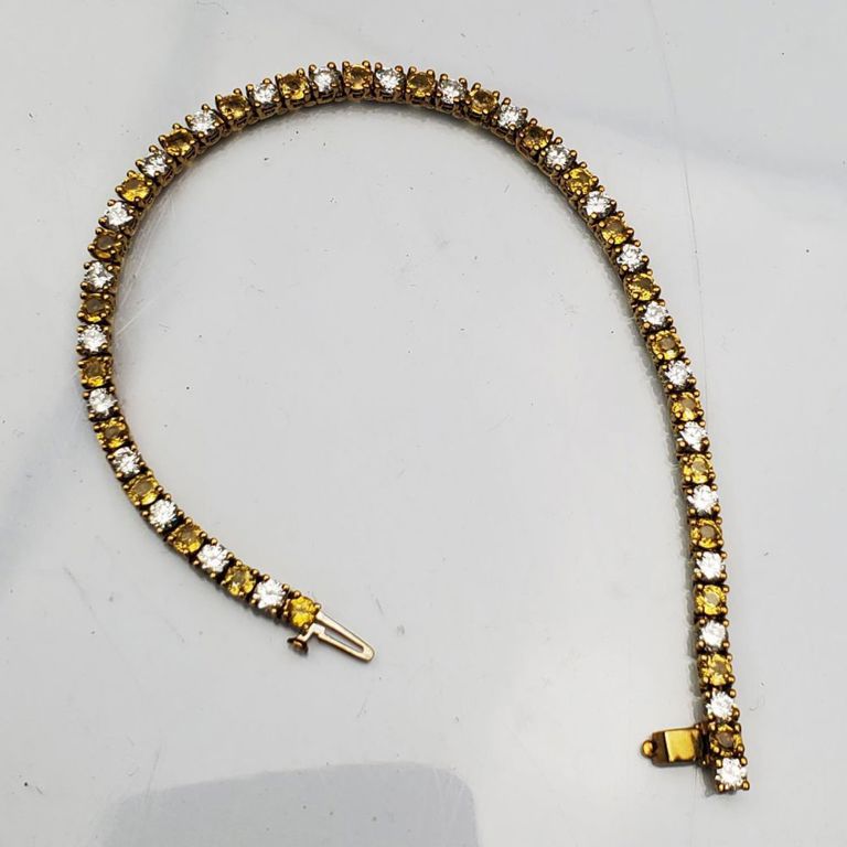 14k gold, diamonds and topaz tennis bracelet