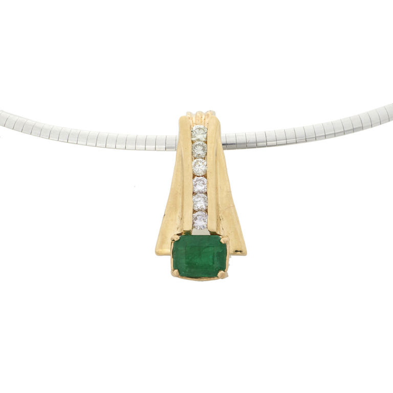 An emerald, diamond and 14k gold pendant necklace