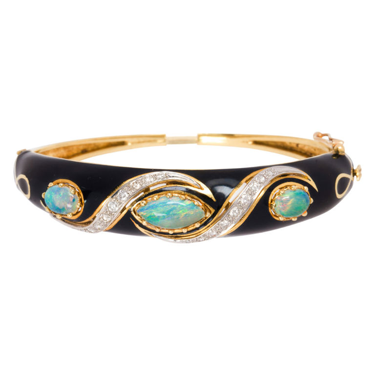 An opal, black enamel, diamond and 18k gold bangle bracelet