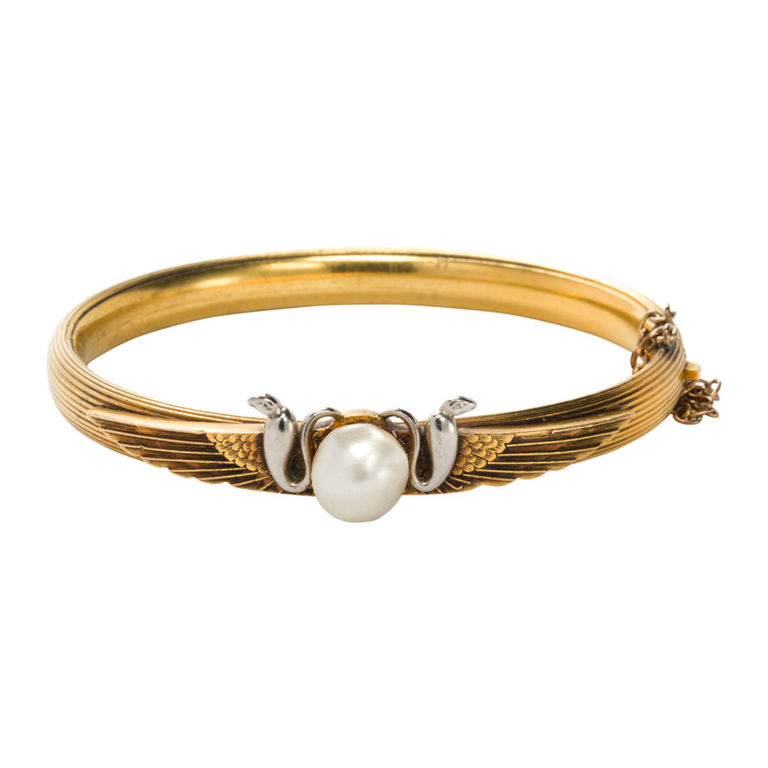 A pearl and 14karat gold bangle bracelet