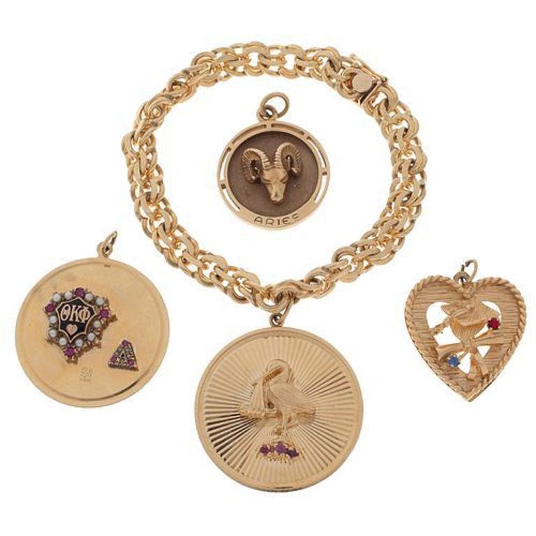 14k yellow gold bracelet with four charms