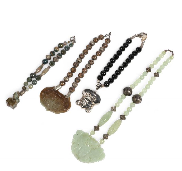 Four Asian hardstone and metal necklaces