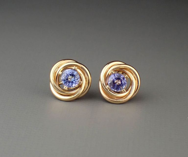 Tanzanite ear studs with 14k yellow gold earring jackets