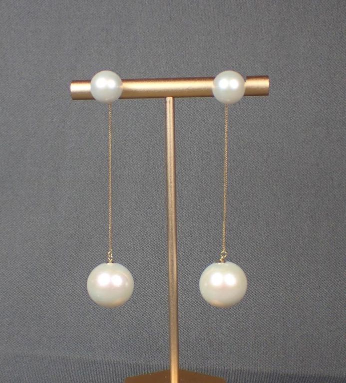 Akoya pearl ear studs with South Sea pearl enhancers