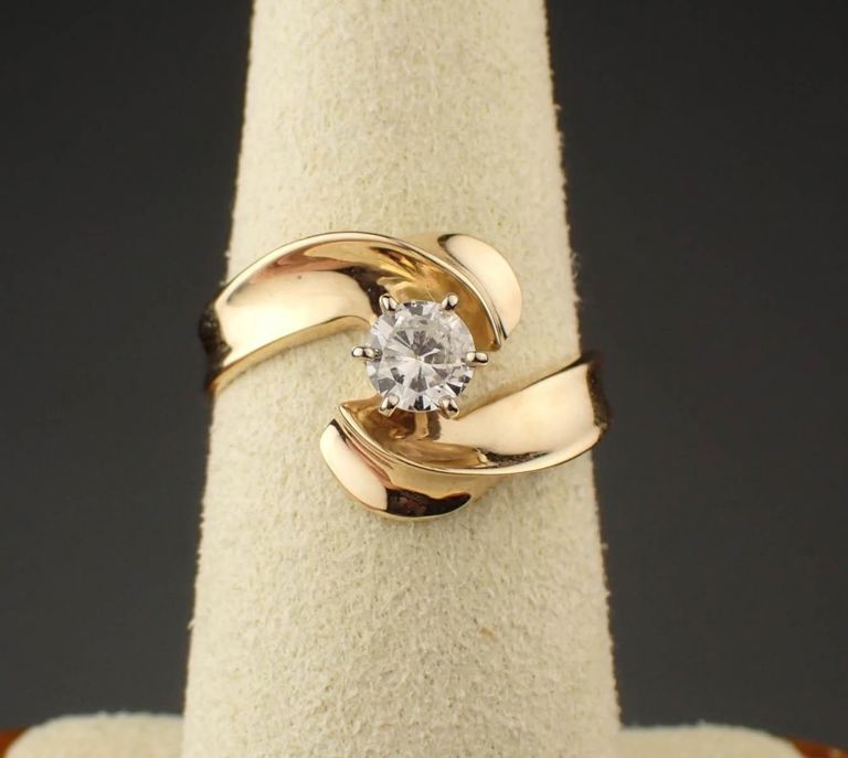 Diamond and 14k yellow gold solitaire ring