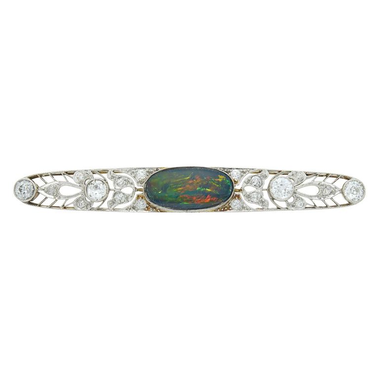 Platinum and gold brooch with black opal and diamond