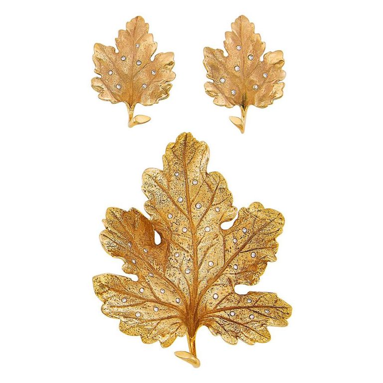 Pair of gold and diamond leaf earrings and brooch