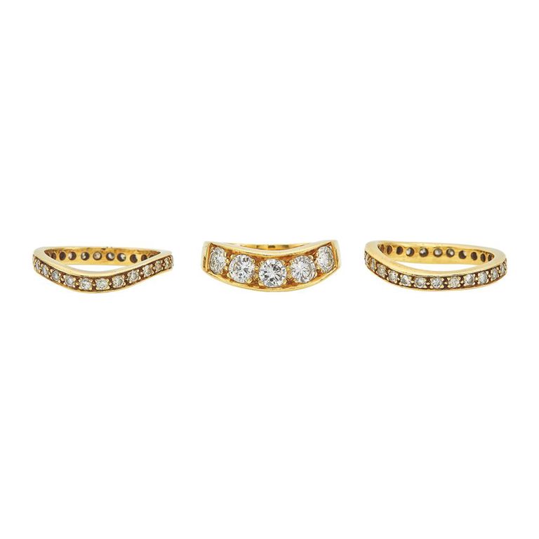 Three gold and diamond band rings