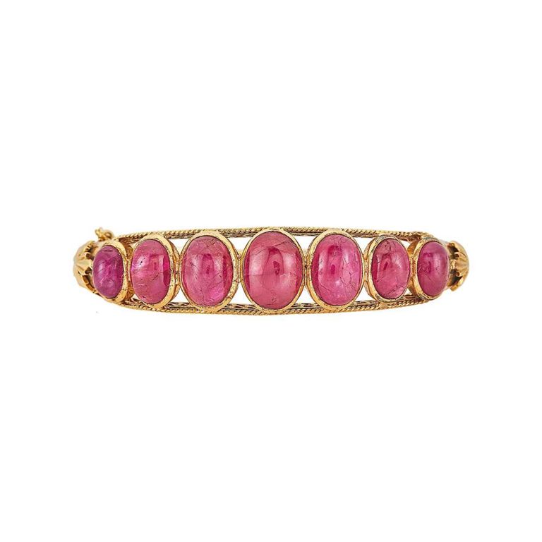 Gold and cabochon ruby bangle bracelet
