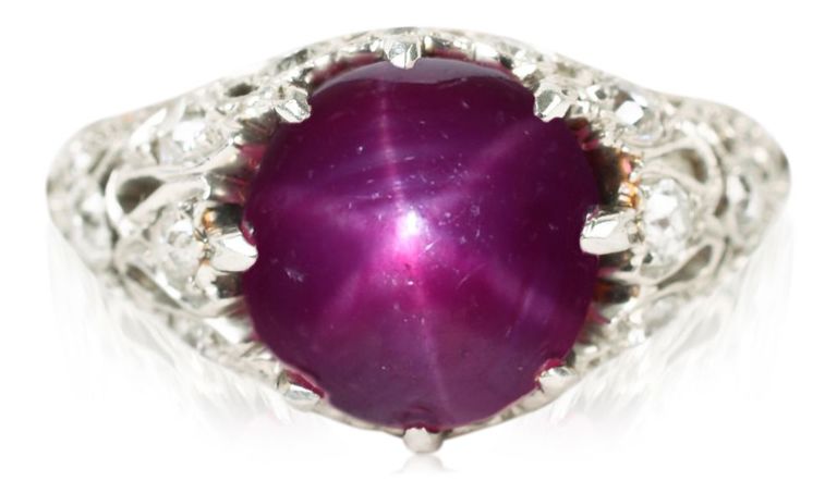Platinum star ruby and diamond ring