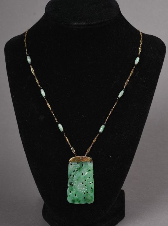 Carved Chinese jadeite pendant and 14k gold necklace