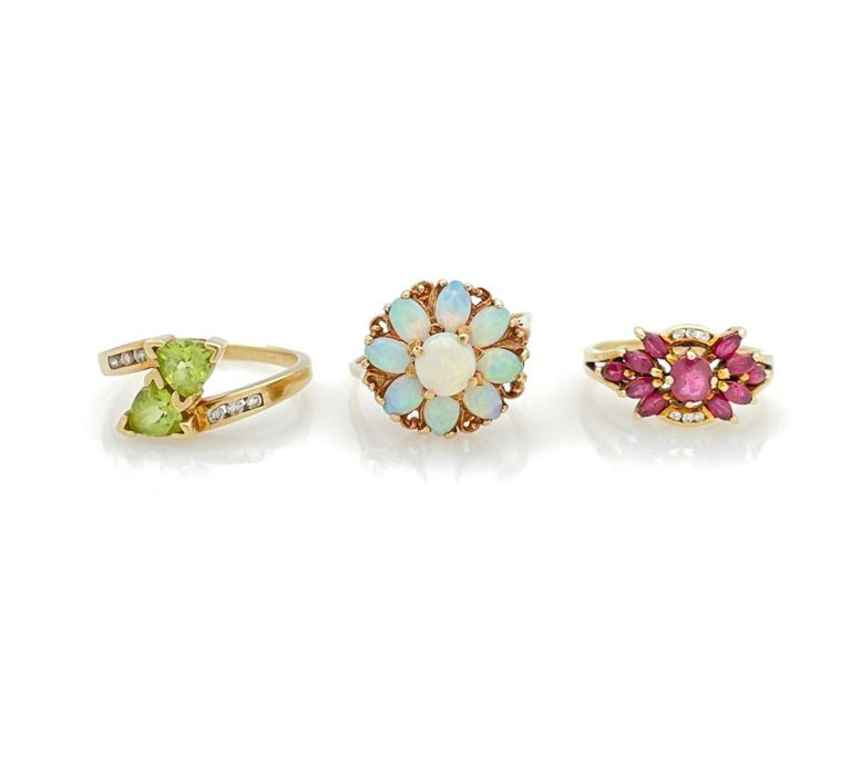 Gold opal, peridot, ruby and diamond rings