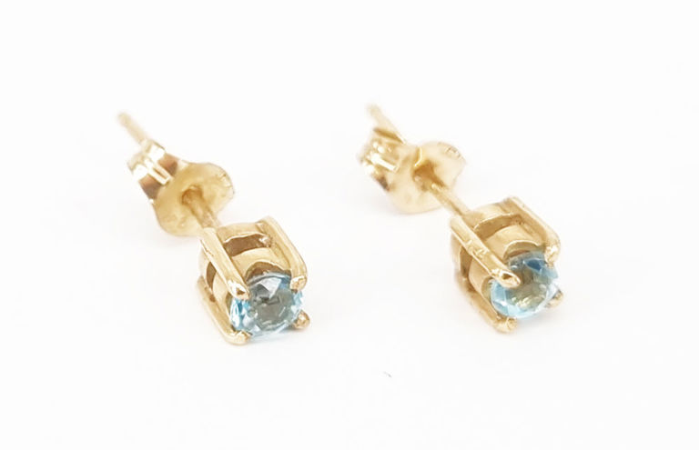 Pair of 9k gold and blue topaz stud earrings