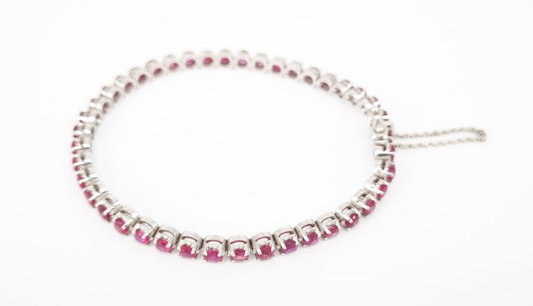 18k white gold tennis bracelet with ruby