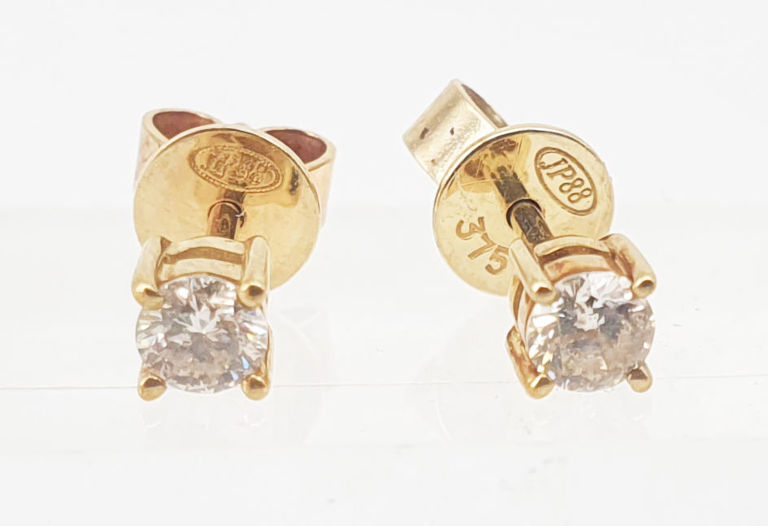 Pair of 9k gold and diamond stud earrings