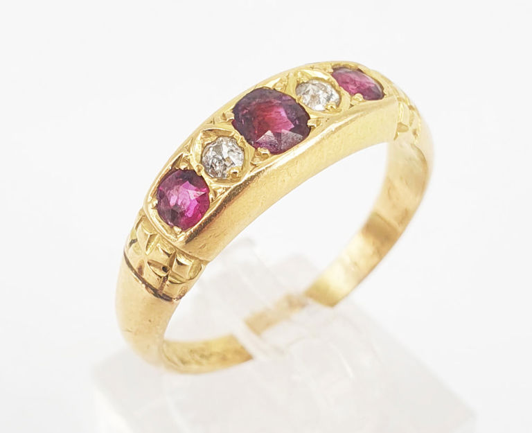 Ruby and diamond five-stone quarter hoop ring