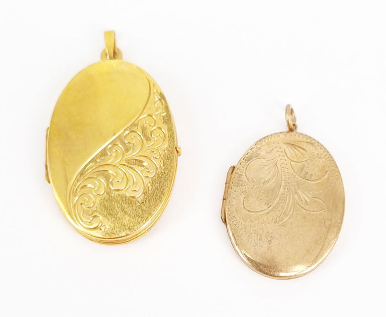 Two 9k gold lockets with engraved foliate design