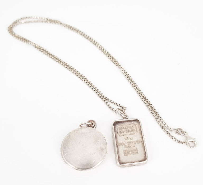 Silver Credit Suisse pendant with chain and circular locket