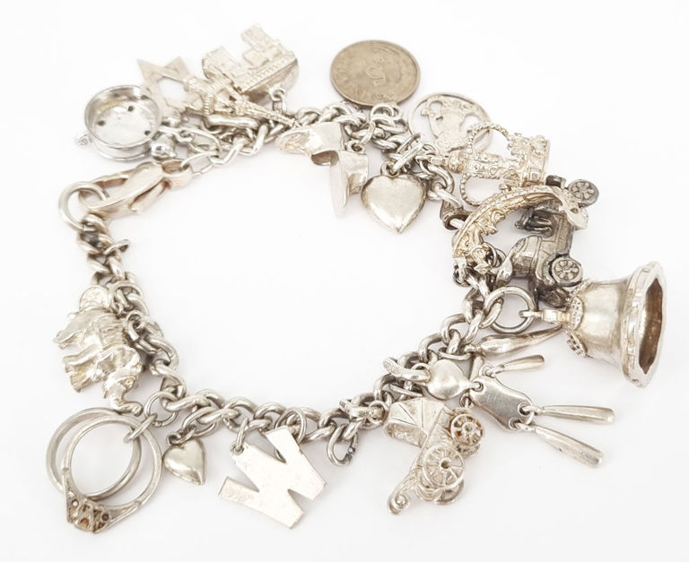 Vintage silver charm bracelet with 20 charms
