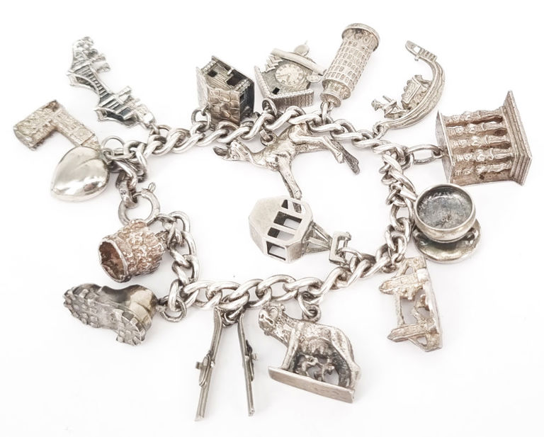 Vintage silver charm bracelet with 16 charms