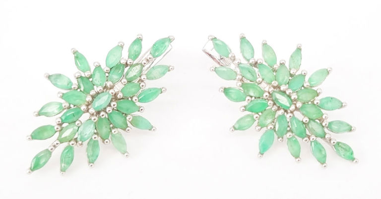 A pair of emerald cluster earrings