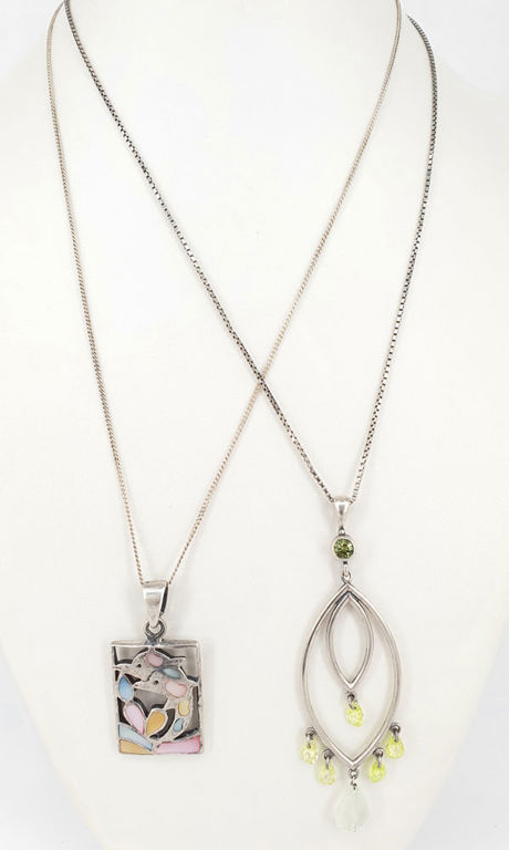 Two pendants in sterling silver with peridot and mother-of-pearl