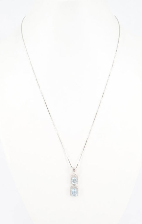 A blue topaz pendant in sterling silver on a chain
