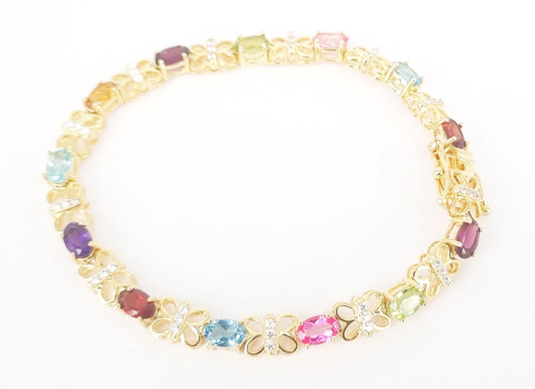 A multi-gemstone bracelet in sterling silver gilt