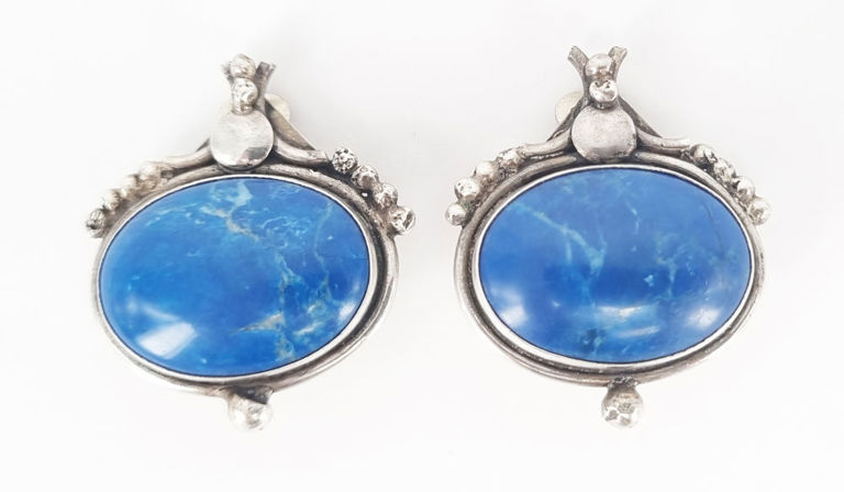 A pair of Egyptian Revival clip-on earrings in silver and blue stone