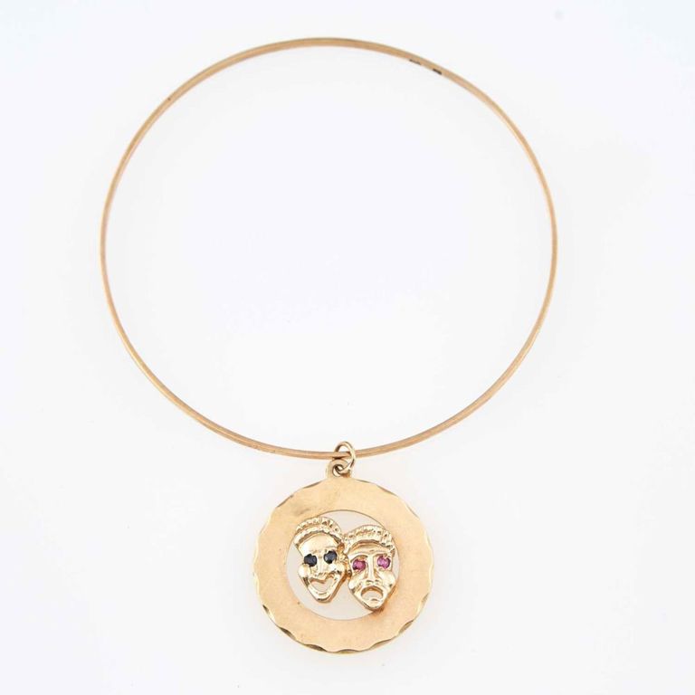14k gold charm bracelet with gold and stone charm