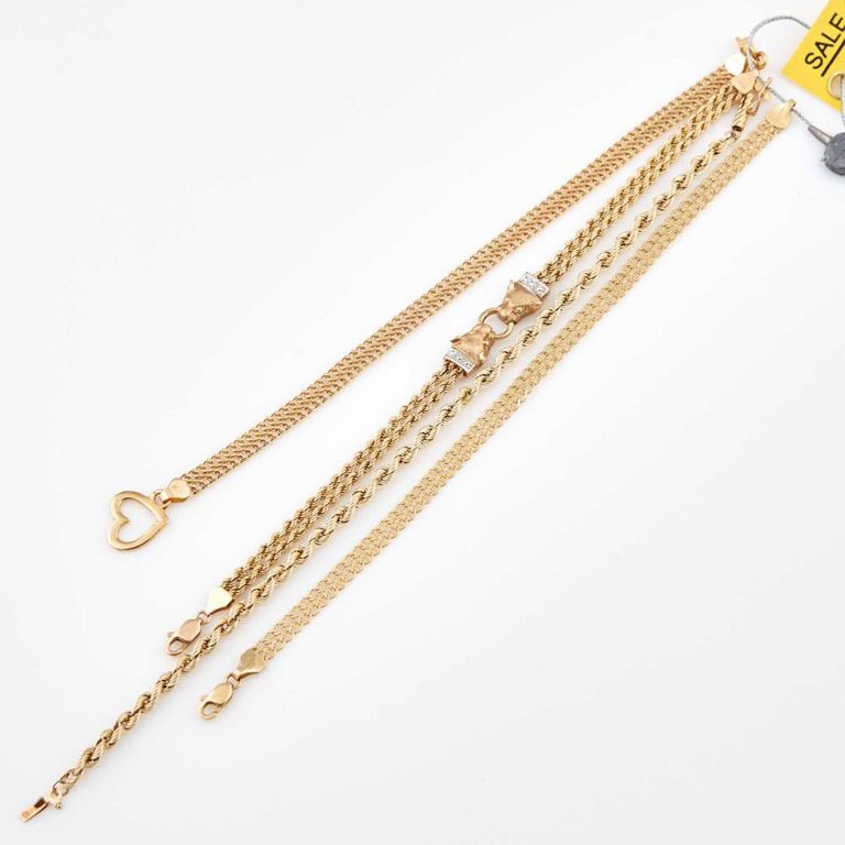 Four 14k gold flexible bracelets