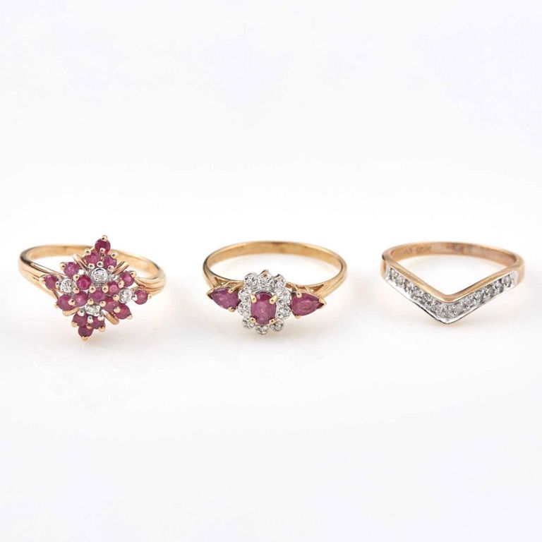 Three 10k gold diamond and stone rings