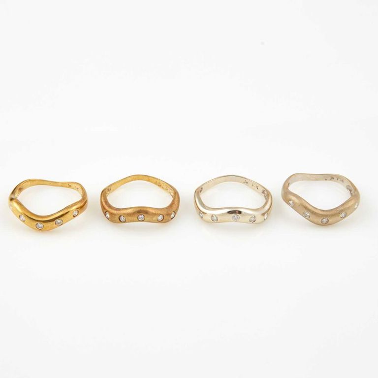 Four 14k gold diamond rings