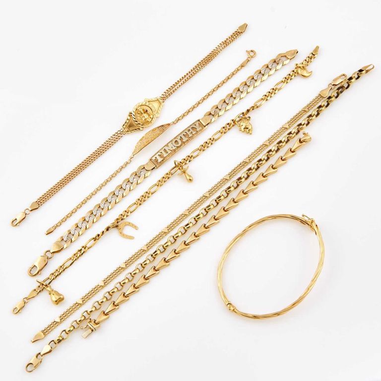 14k and 10k gold and stone bracelets with charms