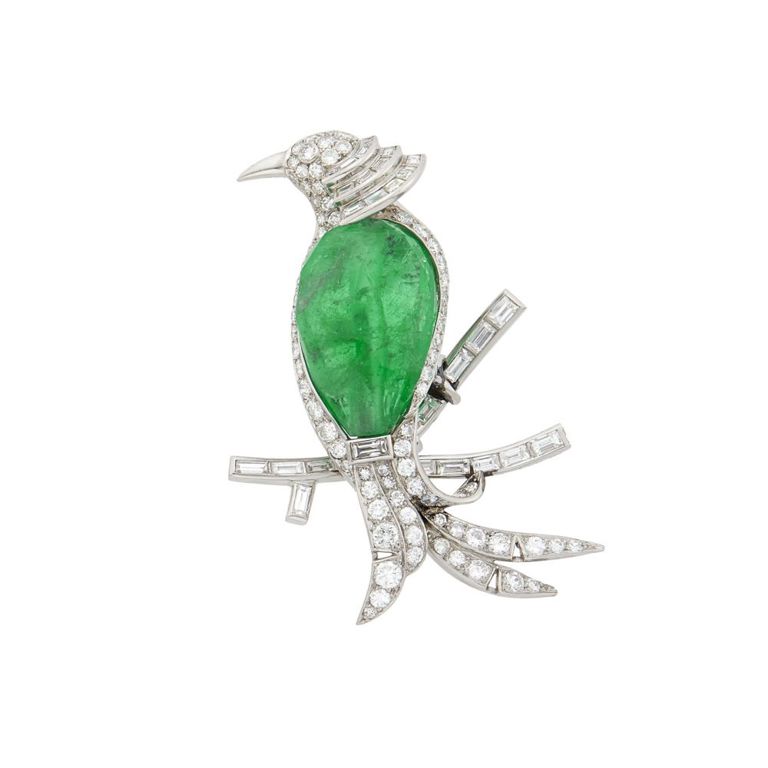 Platinum bird clip-brooch with emerald and diamond