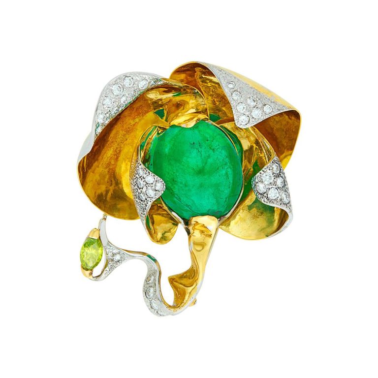 Two-color gold brooch with cabochon emerald and diamonds by Nussberger