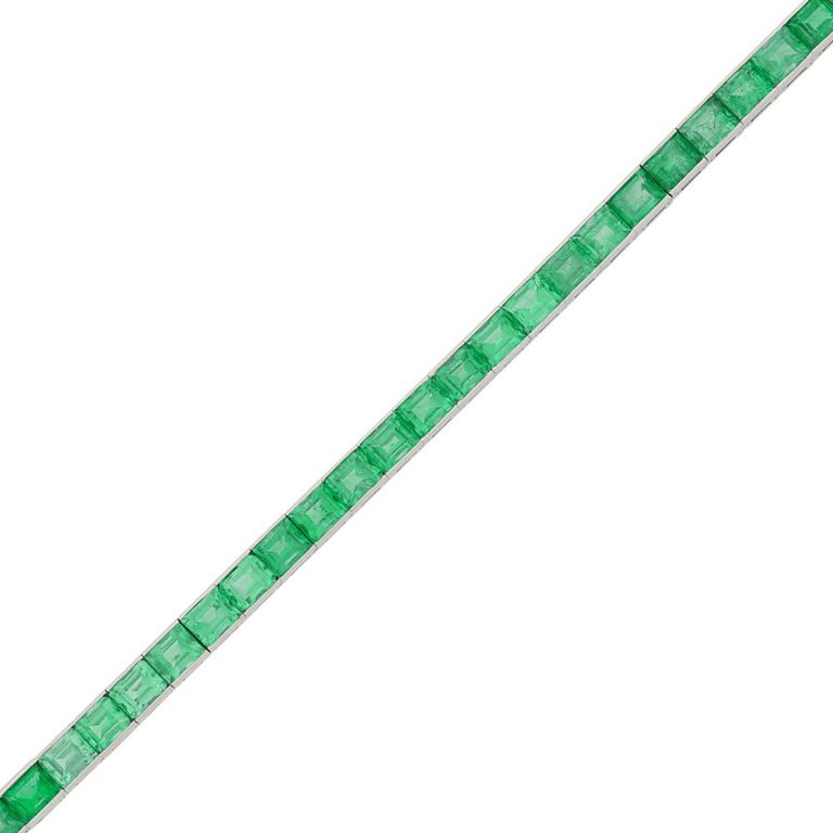 Platinum straightline bracelet with emerald