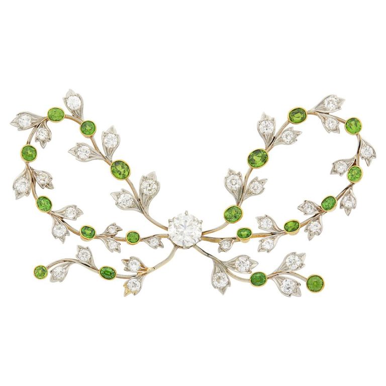 Antique gold platinum diamond and demantoid garnet bow brooch