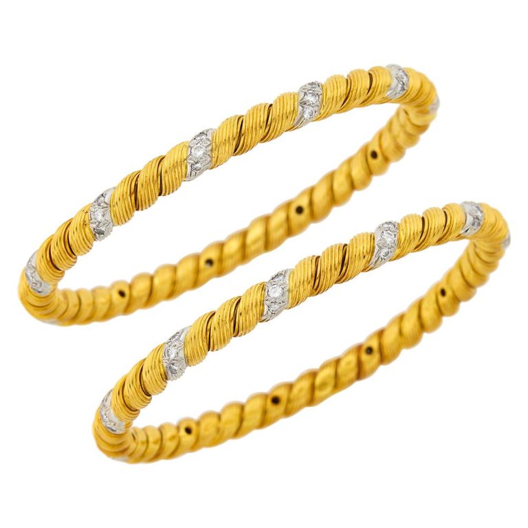 Pair of fluted gold and platinum bangle bracelets